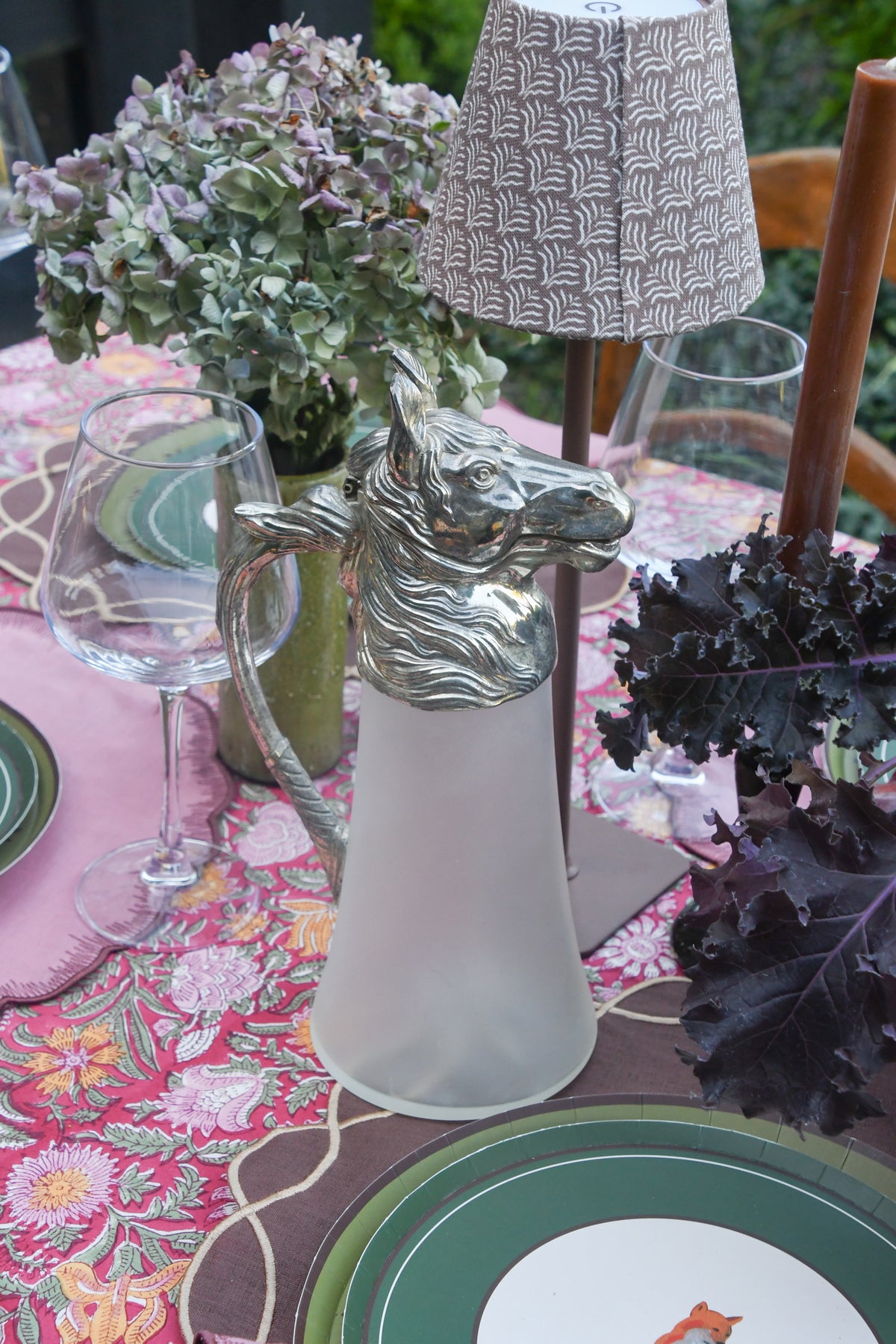 Silverplate horse head pitcher styled on a fall table