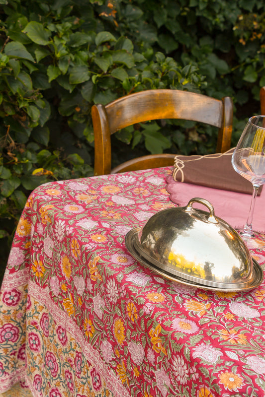 Silverplate oval covered serving platter on a floral tablecloth