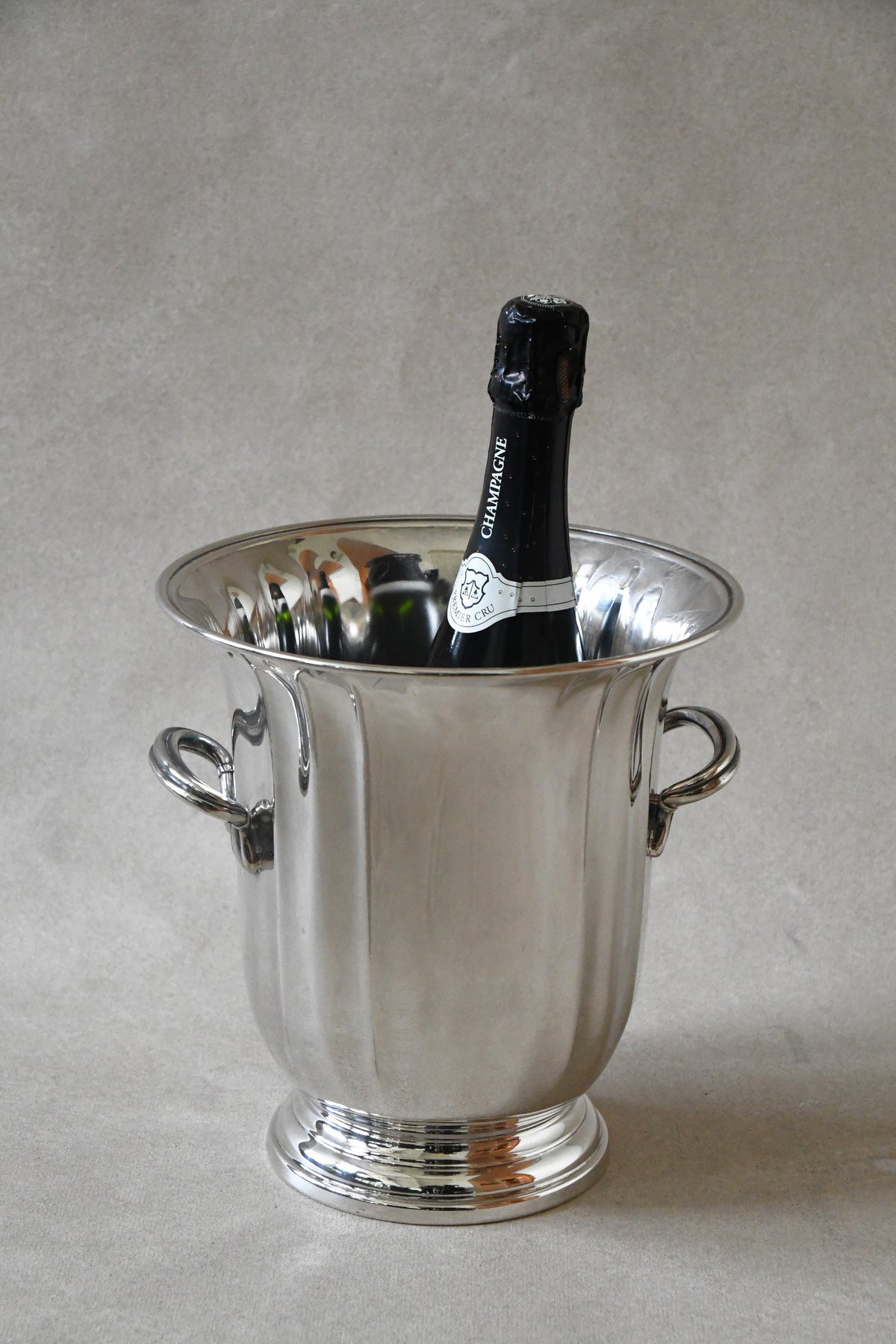 Vintage Gorham Silverplate Champagne Bucket with a bottle of champagne